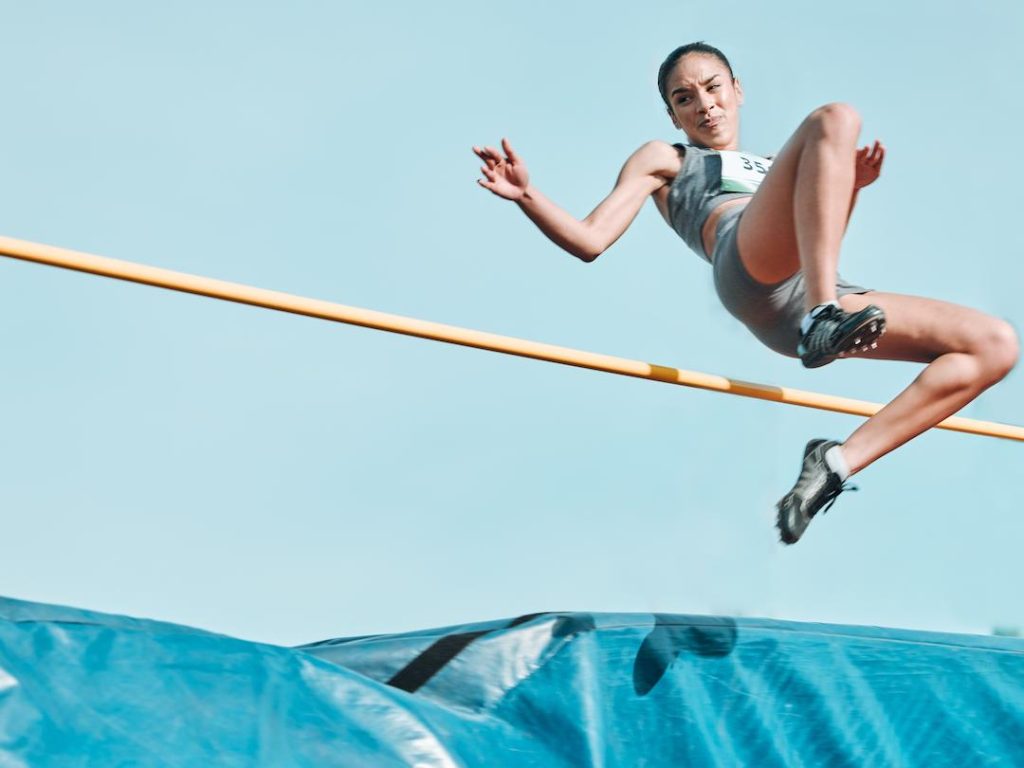 Woman Performing High Jump
